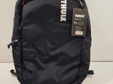 a black backpack that has a tag on it