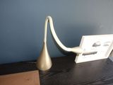 a lamp that is sitting on a table next to a book