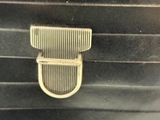 a close up of a comb on the side of a black suitcase