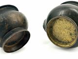 two vases that are sitting next to each other