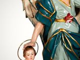 a statue of an angel and a child on a pedestal