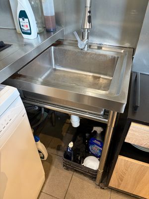 a washer and a dryer in a small kitchen