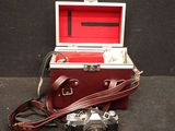 a red case with a camera and a camera strap