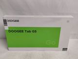 a close up of a box on a white surface with a green background