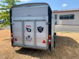 a trailer that has stickers on the back of it