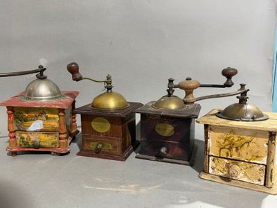 five different types of coffee grinders sitting on a table