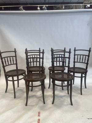 six chairs are lined up in a row on a white background