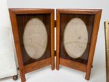 pair of antique wooden picture frames with oval glass inserts