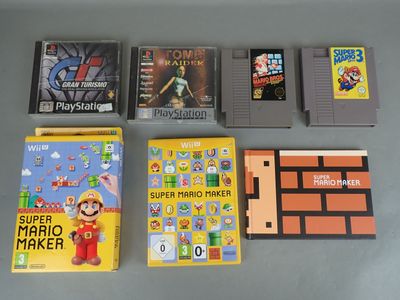 several nintendo games are sitting on a table next to each other