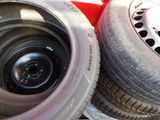 two tires sitting next to each other on the ground