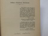 an old book with a handwritten title on it sitting on top of a table