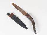 an old knife and a knife blade on a white surface