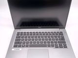 an open laptop computer sitting on top of a white table