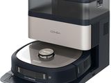 an image of a black and silver coffee maker sitting on top of a table