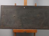 an easel that has a painting on it on it
