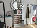 an image of a room with a mirror and a shelf