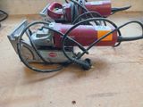 a red machine that is sitting on the floor