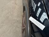 a sticker on the side of a car that is parked on the side of the road