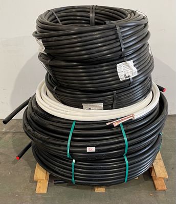 several black and white hoses stacked on top of each other