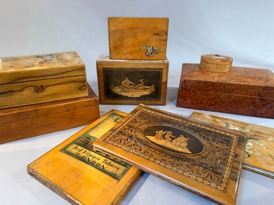 five wooden boxes that are sitting on a table