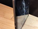 a cell phone that is sitting on a wooden table