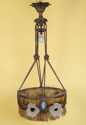 a close up of a chandelier hanging from a yellow wall