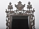 a mirror that is sitting on a table in front of a wall