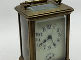 a small clock that is sitting on a table