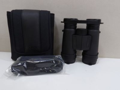 an image of a pair of binoculars sitting on top of a table
