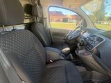 a view of the inside of a van with the driver ' s seat up