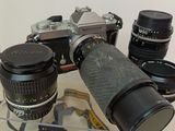 a lot of cameras that are sitting on a table