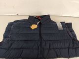 a close up of a blue puffy vest with a tag on it