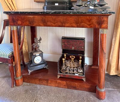 a small table with a clock on top of it