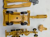 a picture of a toy truck and a construction vehicle