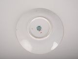 a white plate with a green tree on it