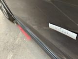 a sticker on the door of a black car