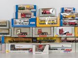 many different types of toy trains on display in a room
