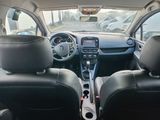 a view of the inside of a car from the driver ' s seat