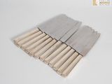 six pieces of wood are arranged in a row on a white surface