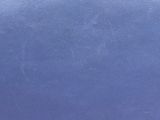 purple and white polka dot fabric on a blue background