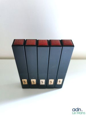 three books are stacked on top of each other on a table