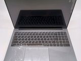 a silver laptop with a black keyboard sitting on a table