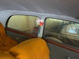 a car with a blanket in the back seat of it
