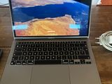 a laptop that is sitting on a wooden table