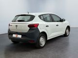 the rear view of a white and black car in a room