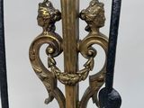 an image of a close up of a metal pole with a clock on top of it