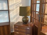a lamp that is sitting on a table in a room