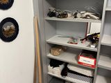 a pantry with a lot of shelves and plates on the wall