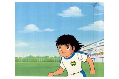 cartoon image of a boy in a soccer uniform running with a soccer ball in his hand