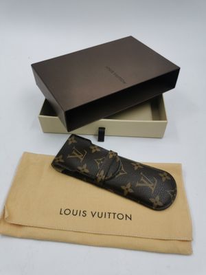 louis vuitton watch case in a box with a brown leather strap